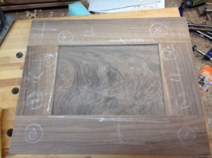 The front with walnut crotch veneered panel inset